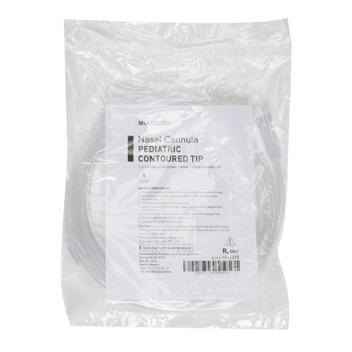 A packaged medical nasal cannula pediatric conoured tip in a clear plastic bag with a white printed label, photographed on a plain white background.