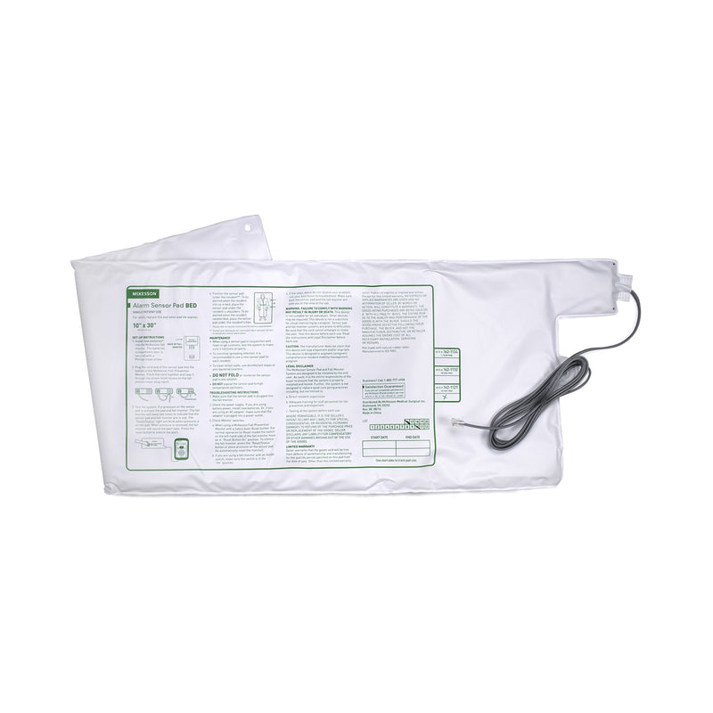 White heating pad with a cable on a white background