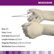 Gloved hands holding surgical scissors with McKesson branding and product specifications.
