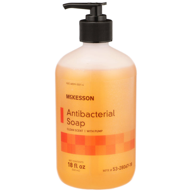 Orange bottle of McKesson antibacterial soap with pump on a white background