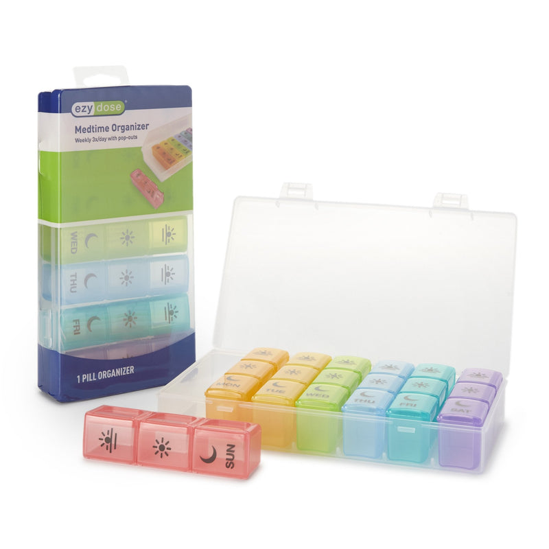 Weekly pill organizer with colorful compartments and packaging on a white background