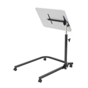 Adjustable standing desk with a white surface on a white background