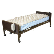 Hospital bed with an air mattress on a white background