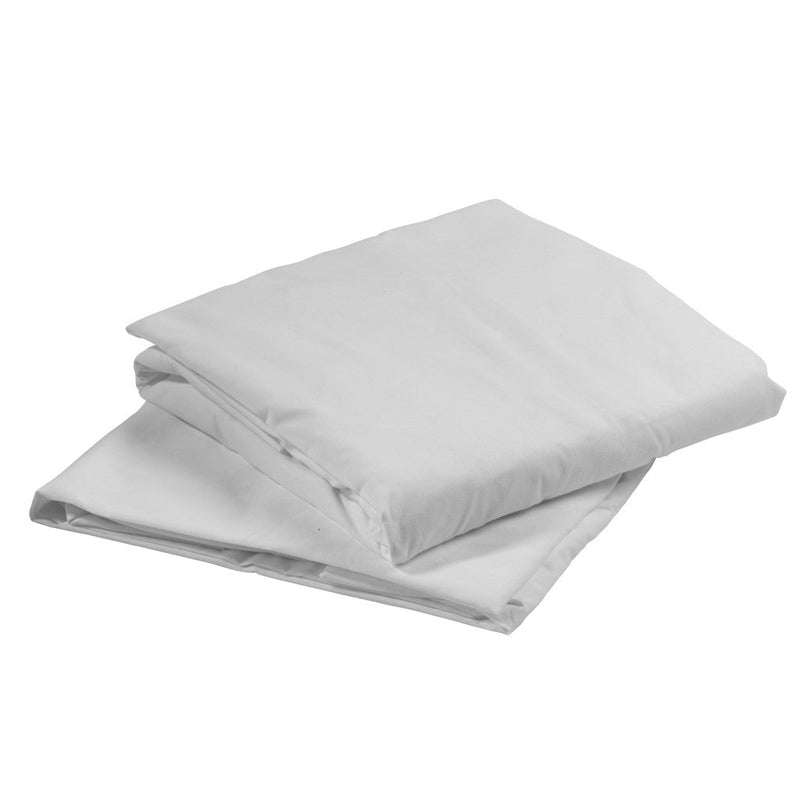 Folded white comforter on a white background
