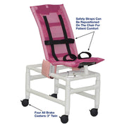 Pink patient transfer chair with safety straps and caster details on a white background
