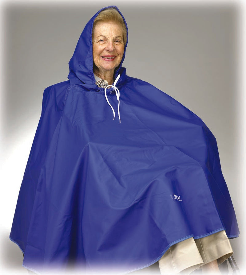Person wearing a blue rain cape on a plain background