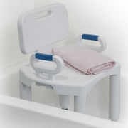 White bath seat with blue handles and a pink towel on a white background