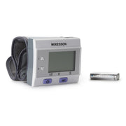 McKesson blood pressure monitor with a battery on a white background