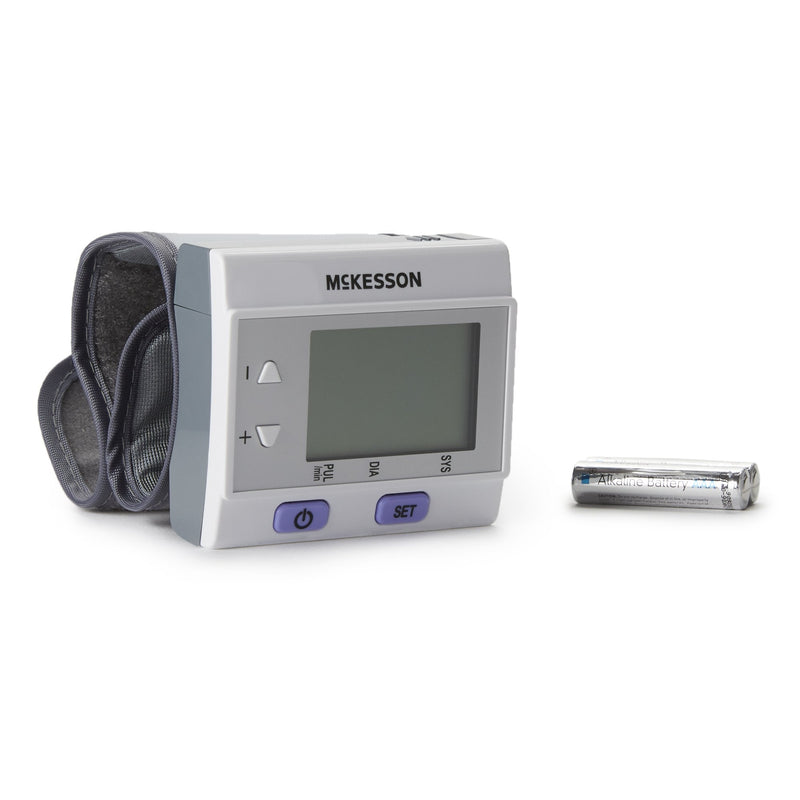 McKesson blood pressure monitor with a battery on a white background