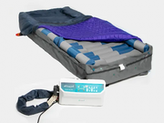 Inflatable mattress with blue cover and power adapter on a white background