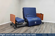 Blue Med Mizer bed with right and left mobility bars on a wooden floor.