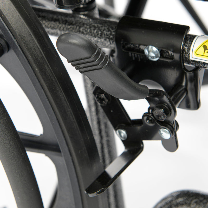 Close-up of a wheelchair brake lever and caliper on a blurred background