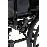 Close-up of a black wheelchair with visible components on a white background