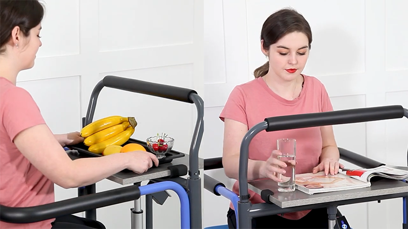 Two women using adjustable height tables with handles in a clinical setting.
