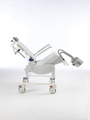 Medical examination table on wheels with a white background