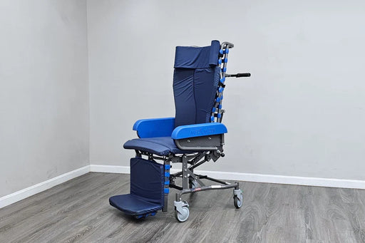 Blue and silver wheelchair in a room with gray walls and wooden floor.