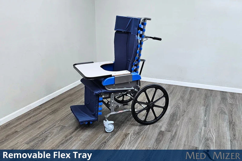 Wheelchair with a removable flex tray on a wooden floor against a white wall, featuring the brand 'Med Mizer'.
