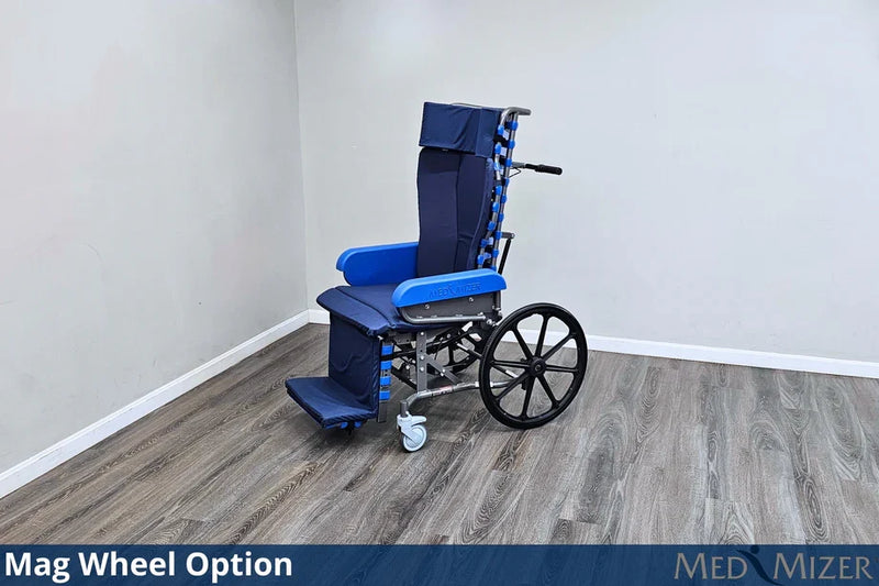 Blue and silver wheelchair with Mag Wheel Option on a wooden floor against a white wall, featuring the Med Mizer brand.