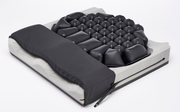 Massage mattress with black textured surface on a white background