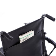 Wheelchair with a pocket holding a newspaper titled 'Finance'
