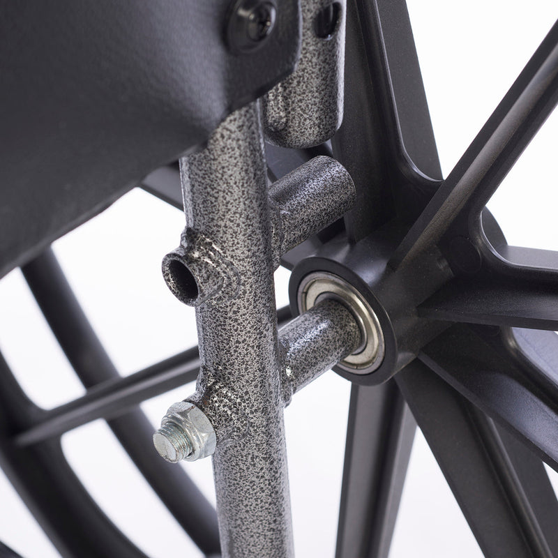 Close-up of a wheelchair metal components on a white background