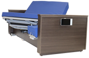 An electric adjustable hospital-style bed frame with a brown wood-grain finish, blue mattress and headboard cushion, and a built-in control panel on the side, shown on a white background.
