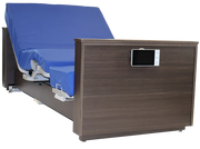 An adjustable hospital-style bed frame with a dark brown wood-grain headboard panel, a built-in control screen, and a blue mattress cover on a white background.