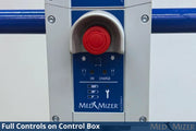 Close-up of a MED MIZER control box showing a red emergency stop button, blue control panel with icons, and silver metal housing.