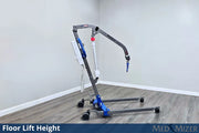 Floor lift height device on a wooden floor with a plain wall background