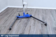 Blue floor jack with 49-inch leg expansion on a wooden floor.