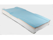 Mattress topper with blue cover on a white background