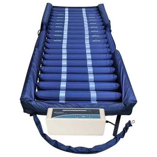 Blue inflatable medical mattress with control unit on a white background
