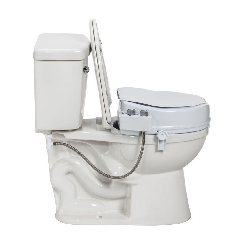 White toilet with additional bidet attachment on a white background