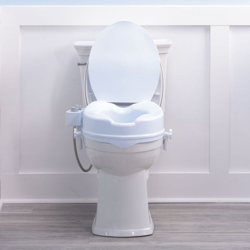 White toilet seat with a raised seat cover on a plain background