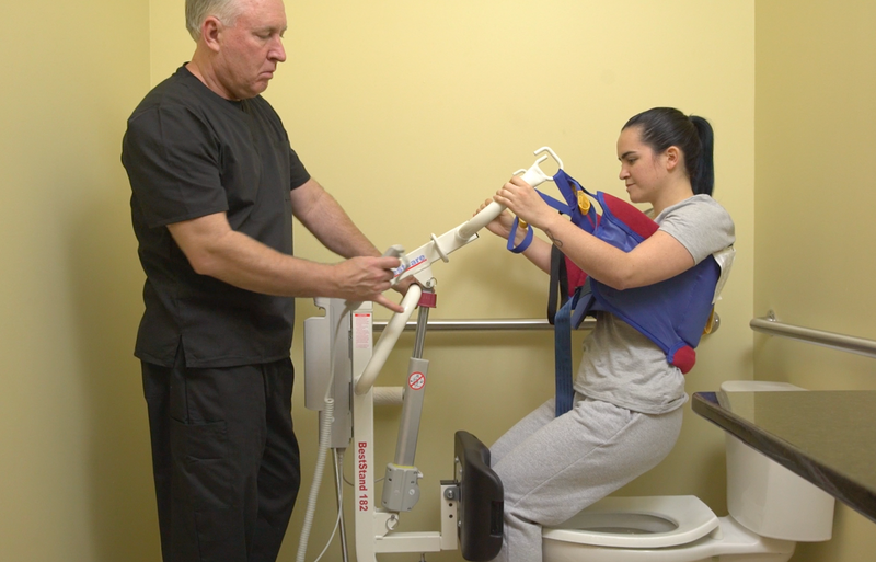 SA182 Beststand being used to help a patient use the toilet