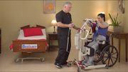 SA400HE being used by a caregiver to lift a patient out of a wheelchair