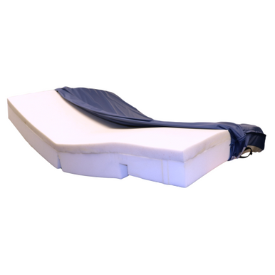 A white contoured foam mattress topper with a navy blue fitted cover, shown on a plain white background.