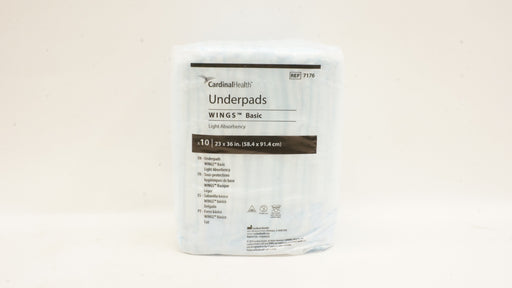 Package of Cardinal Health underpads on a beige background