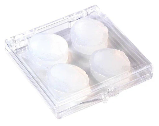 Clear plastic container with four white ear plugs on a white background