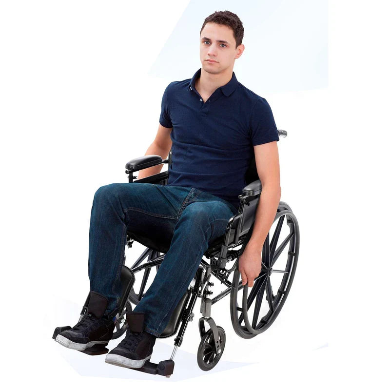 Man sitting in a wheelchair on a white background