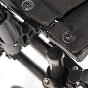 Close-up of a black and gray mechanical or technical component with screws.