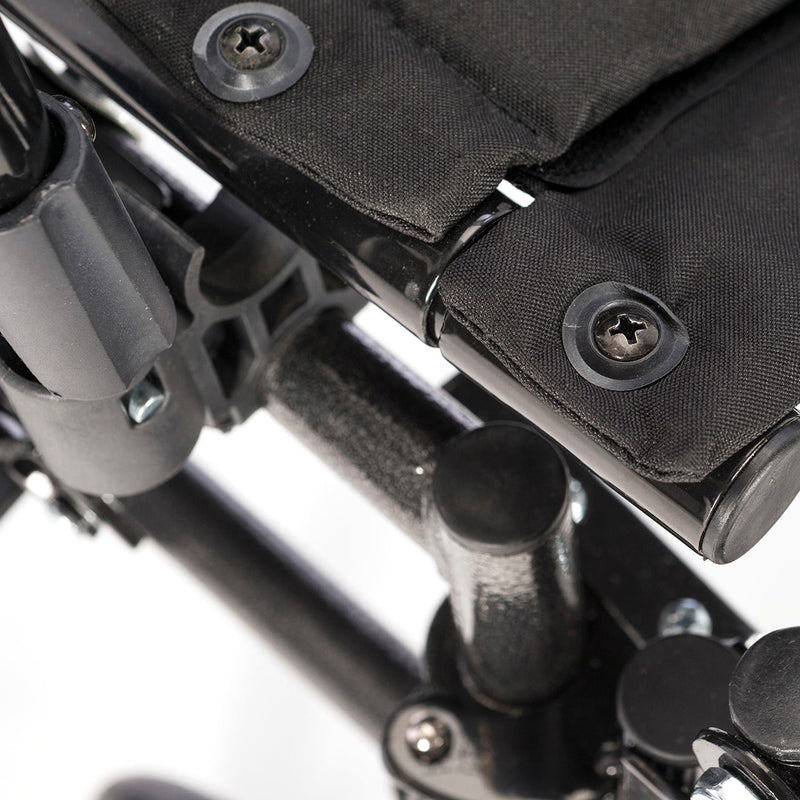 Close-up of a black and gray mechanical or technical component with screws.