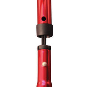 Close-up of a red pen with a black clip on a white background