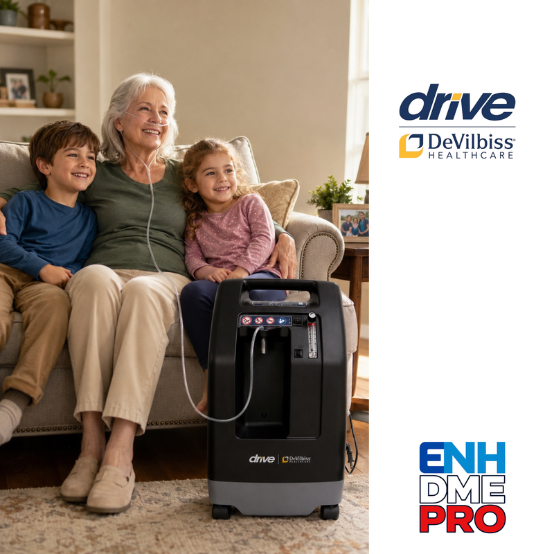 A home-care oxygen concentrator sits on the floor beside a sofa where an older woman and two children are sitting, with DeVilbiss Healthcare and Drive branding visible on the product and in logos on the right side of the image.