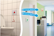 Diagram showing a toilet with a fire alarm and a room with a computer, indicating wireless signal transmission.