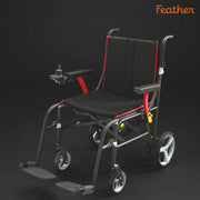 Black and red wheelchair with 'Feather' branding on a dark background
