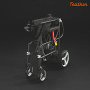 Black rollator with red accents on a dark background, featuring the brand 'Feather'.