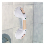 Bathroom safety grab bar attached to a tiled wall