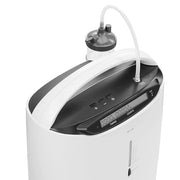 White and black oxygen concentrator with digital display on a white background