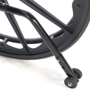Close-up of a black metal wheel with a white background
